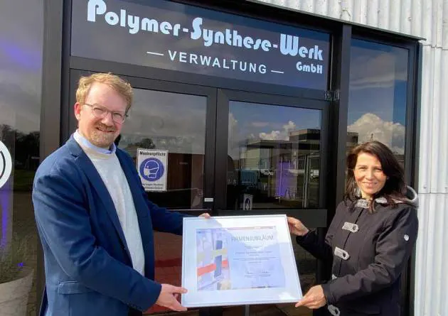 Presentation of anniversary certificate to Christiane Klaus Presentation of anniversary certificate