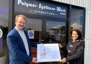 Presentation of anniversary certificate to Christiane Klaus Presentation of anniversary certificate